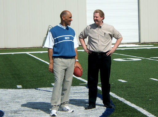 Coach Dungy and Alan discussing the next take