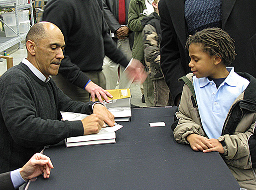 This young fan patiently waits for his book to be signed!