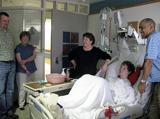 Tony and Winners talking with the patients