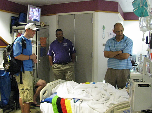 Tony and Winners talking with the patients