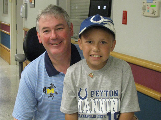 Winner talking with patients