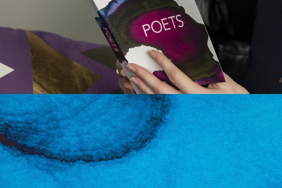 Young woman reading Immerse: Poets