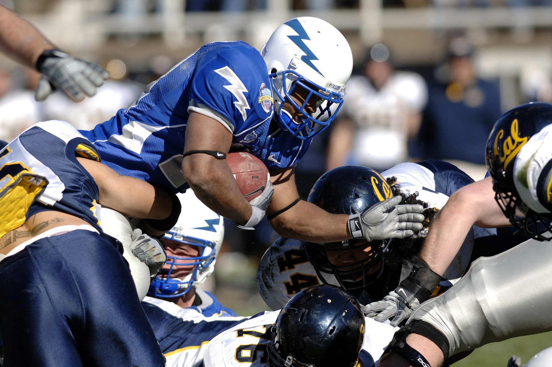 football players getting tackled