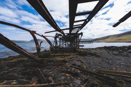 bridge ruins near the edge of a lake