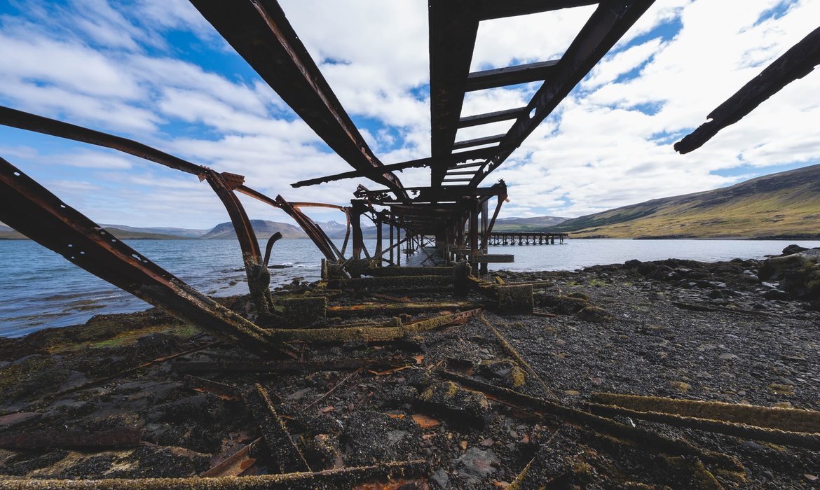 bridge ruins near the edge of a lake