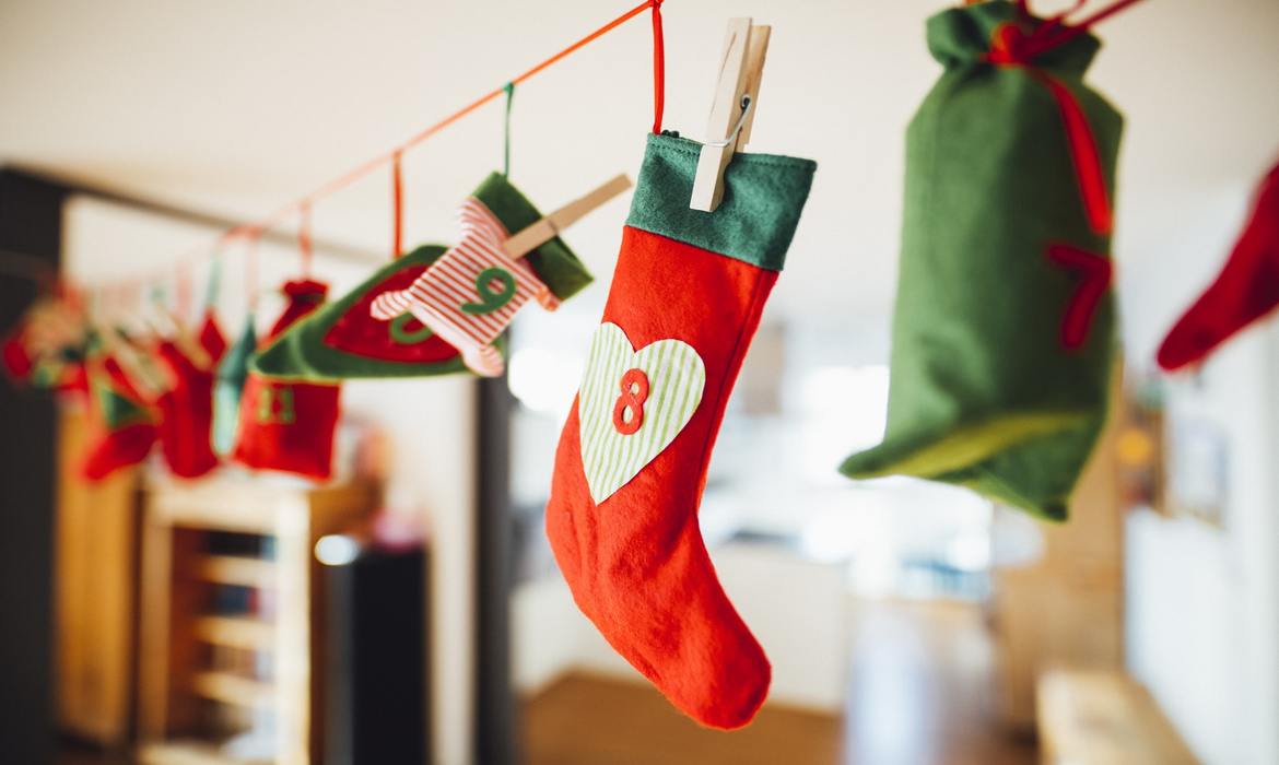 christmas stockings hanging on clothesline with clothes pins