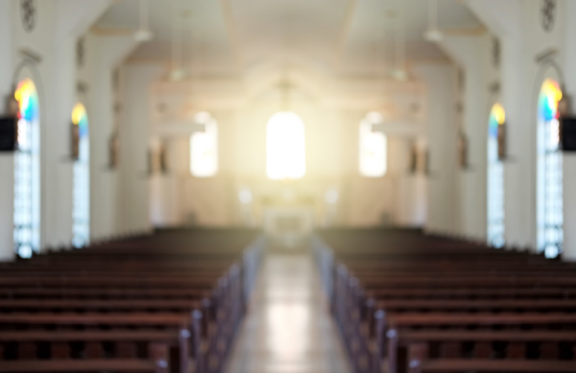 interior of empty church with light coming through front windows