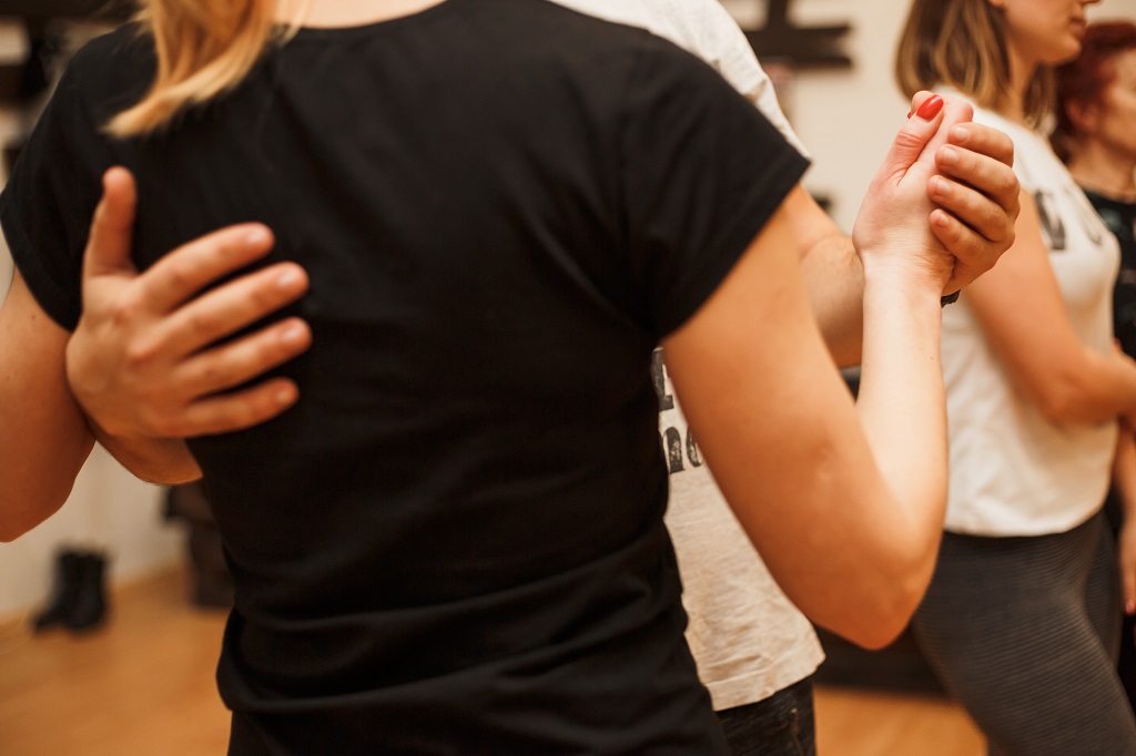 close-up of man and woman dancing in closed position