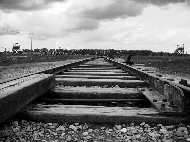 Old-looking wooden train tracks lead off into the distance. Recovery is a journey, but God is here with you every step of the way.