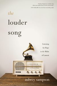 The front cover of Aubrey's book, The Louder Song, a powerful exploration of lament, and how God's healing is always the 'louder song' than our own pain.